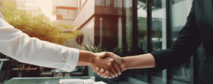 A woman shaking hands with her State Farm insurance agent