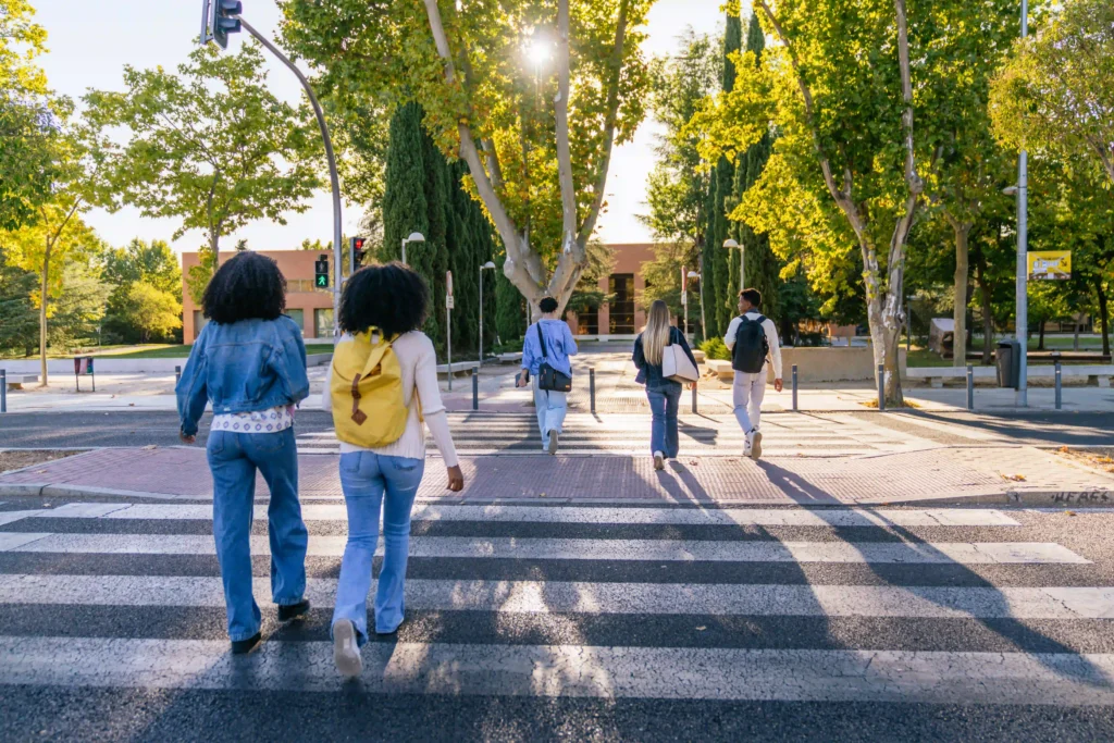 College students using a crosswalk on campus
