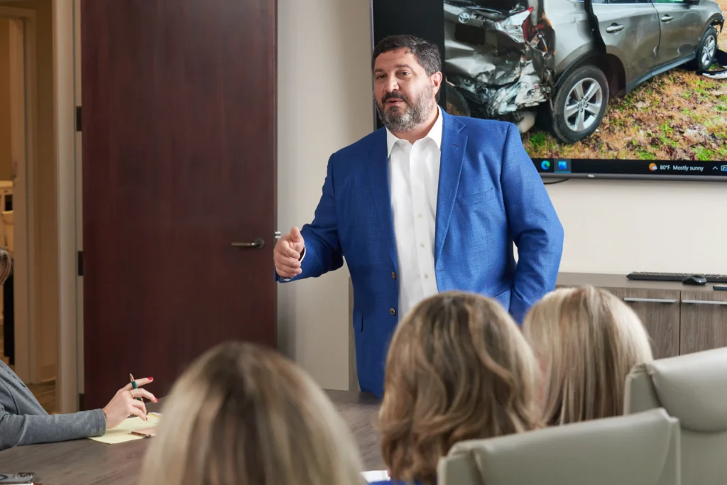 Steven Mezrano talking to staff in conference room