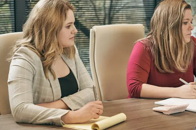 Mezrano® Law Firm employees sitting in conference room