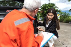 Photo of man and woman at the car standing