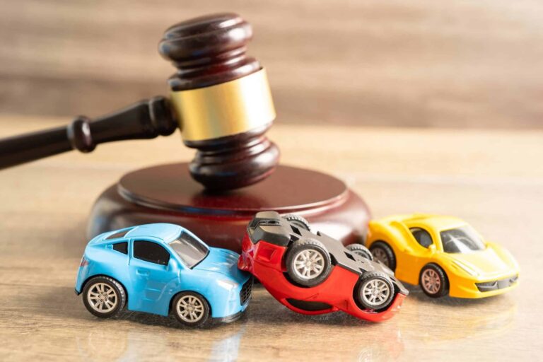 Judge gavel in car accident, insurance coverage