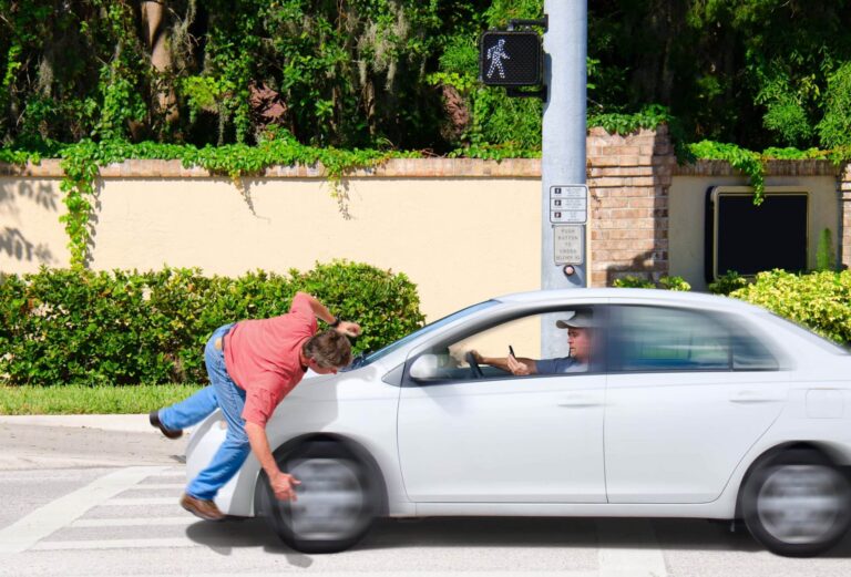 A man texting while driving drives over a pedestrian
