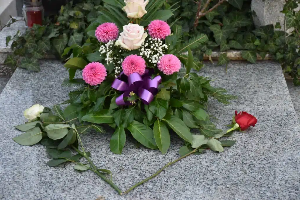 Flowers laid on grave stone