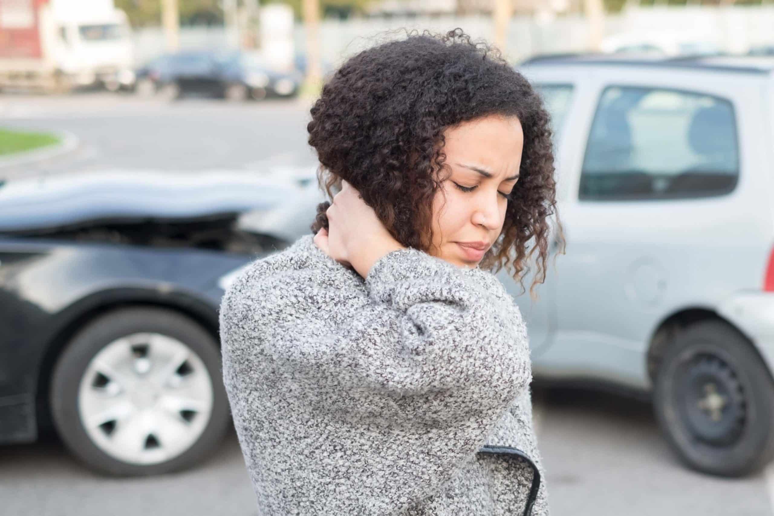 Injured woman feeling ill after a truck accident