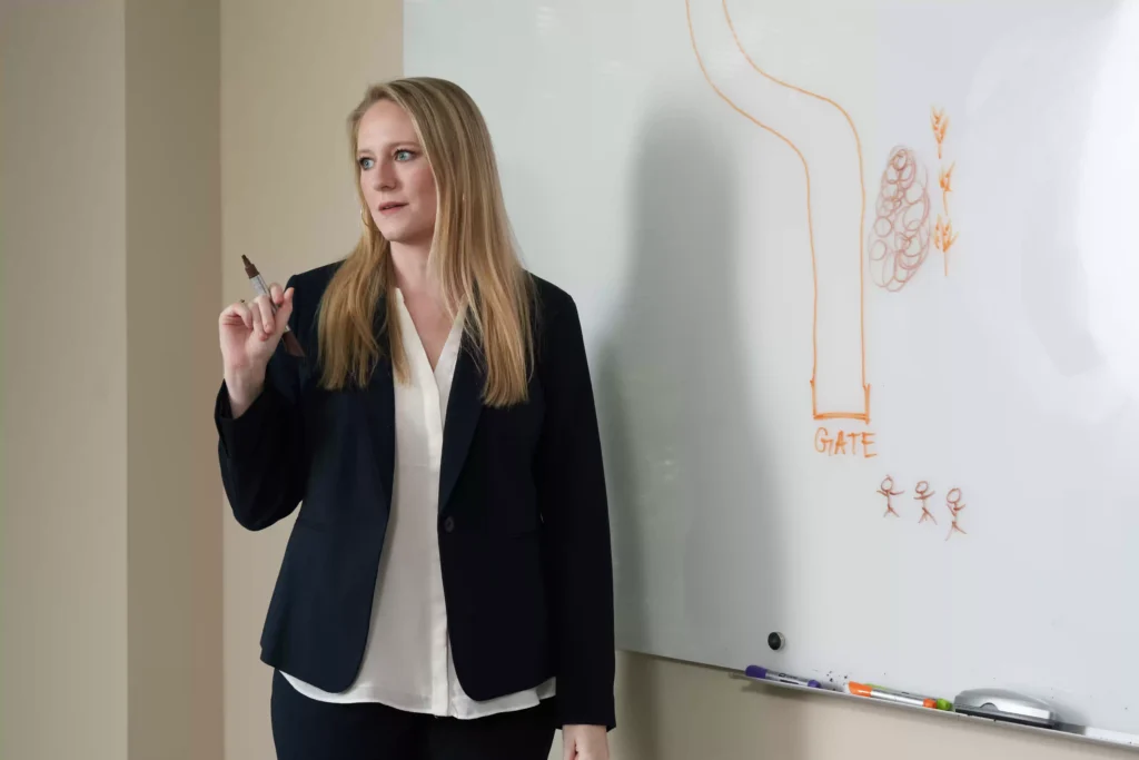 Leah Johnson presenting a case to staff from Mezrano® Law Firm