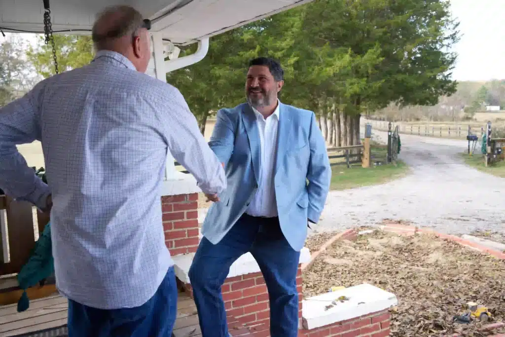 Steven Mezrano shaking hands with recent client