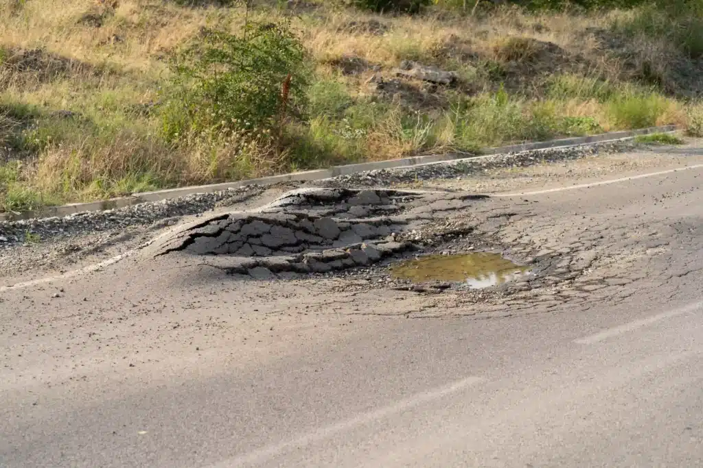 Big pothole on side of road