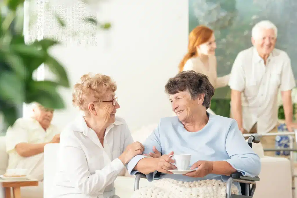 Elderly women talking in nursing home